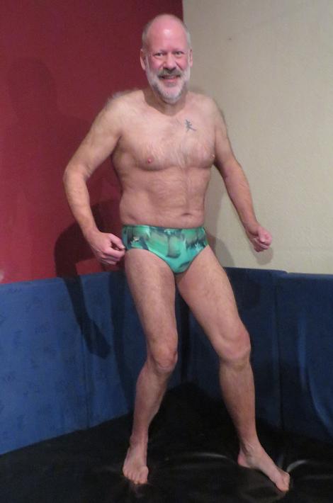 Man in green shop speedo